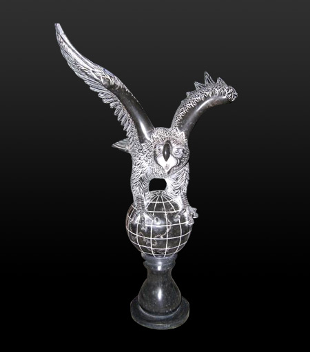 stone owl sculpture